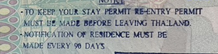 Close-up of a Thai immigration passport stamp warning that a stay permit requires a re-entry permit before leaving Thailand