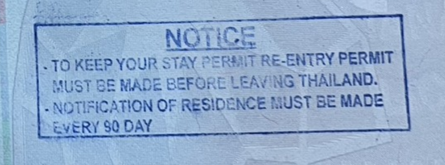 Full view of a Thai immigration notice stamp explaining that a stay permit requires a re-entry permit before departure